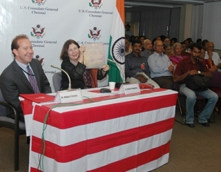 Public Affairs Officer Michael Pelletier and Dr. Deborah Thiagarajan, Founder and President of the Madras Craft Foundation holding a copy Yankee India by Susan Bean.