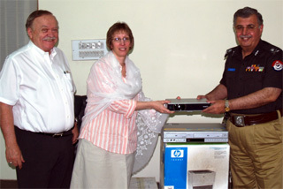 Peshawar, June 3, 2008 – U.S. Consulate Peshawar Principal Officer Lynne Tracy handing over office equipment to the Inspector General of NWFP Police, Malik Naveed Khan. Senior Development Advisor Bob Traister is also present on the occasion.