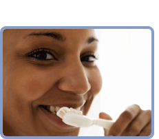 Woman brushing teeth