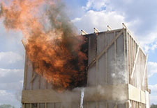 Photo of burning 16X16 foot two-story structure.  Click here for larger image.