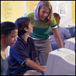 Three People at a Computer