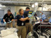 Galveston Island, TX, September 19, 2008 -- Members of the Disaster Medical Assistance Team provide patient care at the mobile emergency facility set up at the University of Texas Medical Branch. FEMA News Photo