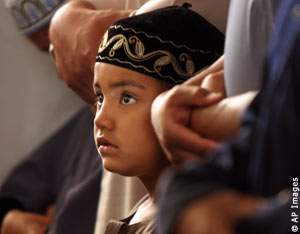 A Muslim boy praying (AP Images)