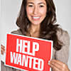 Woman holding help wanted sign