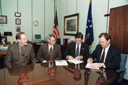 From L-R: The Dow Chemical Company's Mark Spence and Bart Gliatta watch while OSHA's Assistant Secretary, John Henshaw, and Dow's Sam Smolik sign their Alliance