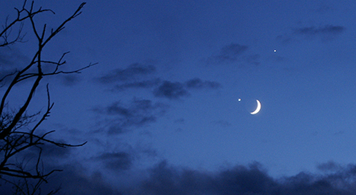 Color image of the Moon and Venus in a dark blue sky.