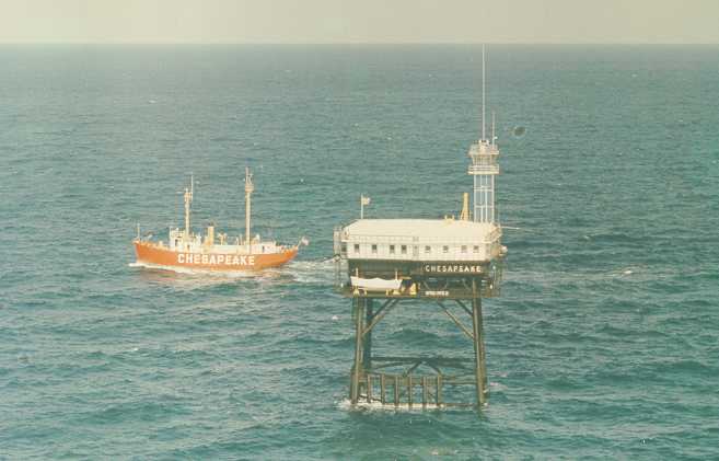 A photo of Light Vessel 116 being relieved by the Chesapeake Light Tower