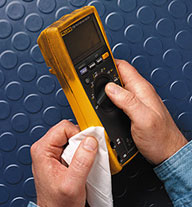The hands of a man cleaning an air sampling device