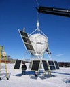 The Advanced Thin Ionization Calorimeter balloon payload is held off the ground by a crane