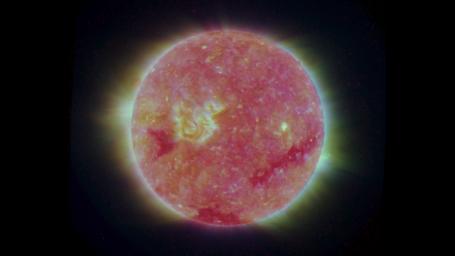 This image is a composite of left and right eye color image pairs taken by the SECCHI Extreme UltraViolet Imager (EUVI) mounted on the STEREO-B and STEREO-A spacecraft. STEREO-B is located behind the Earth, and follows the Earth in orbit around the Sun.