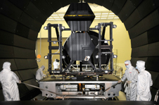 Technicians prepare JWST mirrors for testing in a vacuum chamber.