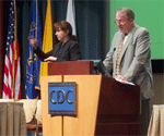 Thomas A. Pearson, MD, PhD, MPH, from the National Center for Deaf Health Research and a sign language interpreter