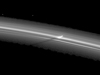 a shadow is cast by a narrow, vertically extended feature in the F ring.