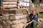 A man working on the foundation of a house.