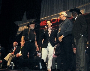 Congressman Boren on stage with Willie Nelson, Morgan Freeman and local officials for the dedication of an Earth Biofuels Inc. biodiesel production facility in Durant, Oklahoma