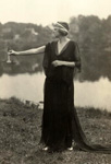 Woman in Greek costume holding scales.