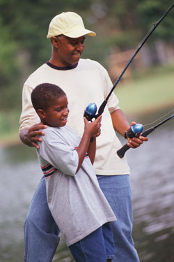 photo of father and son fishing