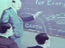 artist concept of Dr. Goddard at a blackboard