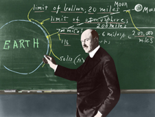 Colorized black-and-white photo of Dr. Robert Goddard at a chalkboard.