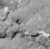 This image of the surface of comet Tempel 1 was taken about 20 seconds before Deep Impact's probe crashed into the comet at 10:52 p.m. Pacific time, July 3. This particular region contains the impact site.