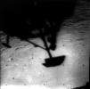 Image of Surveyor 1's shadow against the lunar surface in the late lunar afternoon, with the horizon at the upper right. Surveyor 1, the first of the Surveyor missions to make a successful soft landing, proved the spacecraft design and landing technique