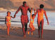 image of African American family walking on a beach