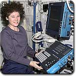 IMAGE: Expedition Two Flight Engineer Susan Helms works at the Human Research Facility.