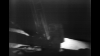 Partially restored video of Neil Armstrong making his way to the lunar surface, by climbing down the lunar module ladder.