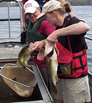 image of men holding fish