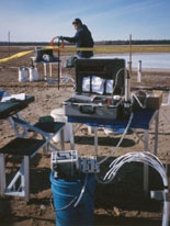 A technician is collecting water-quality samples from a multi-level well at the former Wurtsmith Air Force Base, Oscoda, MI. The samples were analyzed for chemical constituents that are indicators of natural attenuation processes