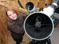 Photo showing Caroline Moore at work in her home observatory