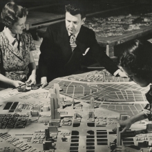 Norman Bel Geddes with Futurama Diorama, Photograph by Richard Garrison, ca. 1939.  Image courtesy of the Edith Lutyens and Norman Bel Geddes Foundation / Harry Ransom Center.