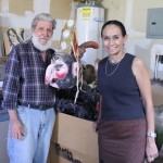 Mexic-Arte Founder Sylvia Orozco receives Mask Collection from Mr. Carmine De Vivi during a recent visit to New Mexico.