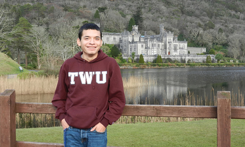 photo of a TWU student in front of an English castle