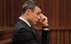 Oscar Pistorius sits in the dock during his trial in the North Gauteng High Court in Pretoria on 1 July 2014