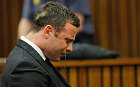 Oscar Pistorius cries while the verdict is being read
