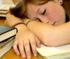 girl sleeping on books