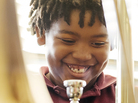 Amir Pinkney-Jengkens, 8, is learning trombone through Harmony Project, a nonprofit that provides musical instruments and instruction to children in low-income communities. Recent research suggests that such musical education may help improve kids' ability to process speech.