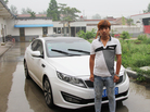 Handsome Zhang — that's his real name in Mandarin -- runs a shipping company, one of many supporting businesses spawned by East Wind village's furniture industry. The shipping business helped Zhang, 25, buy this Kia sports car.