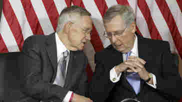 Senate Majority Leader Harry Reid of Nev., left, talks with Senate Minority Leader Mitch McConnell of Ky. The two Senate leaders were on opposite sides of a proposed constitutional amendment to limit fundraising and spending in campaign politics.