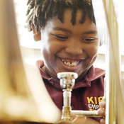 Amir Pinkney-Jengkens, 8, is learning trombone through Harmony Project, a nonprofit that provides musical instruments and instruction to children in low-income communities. Recent research suggests that such musical education may help improve kids' ability to process speech.