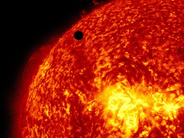 A view of Venus, black dot at top center, passing in front of the sun during a transit in 2012. A quarter of Americans questioned failed to answer correctly the most basic questions on astronomy.