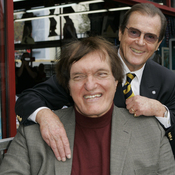 Richard Kiel (front) and Roger Moore at a ceremony in 2007 to honor Moore with a star on the Hollywood Walk of Fame. Kiel, who played Jaws in two Bond films opposite Moore, died Wednesday. He was 74.