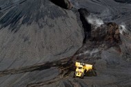 A bulldozer moves coal at the Foresight Energy mine in Carlinville, Ill.