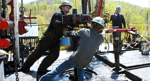 Workers on a natural gas site are pictured. | AP Photo