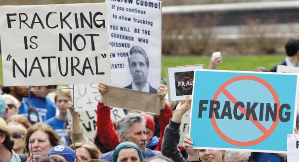 People hold signs during a rally against hydraulic fracturing for natural gas in the Marcellus Shale region of the state, at the Capitol in Albany, N.Y., on Monday, April 11, 2011. | AP Photo