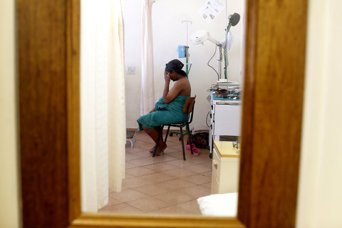 A pregnant woman waiting in the labor ward at the Ndlovu Medical Center in Groblersdal, north of Johannesburg. The clinic offers its patients numerous services, including an on-site H.I.V. monitoring laboratory. Feb. 17, 2014.