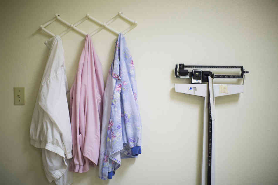 Jackets, once worn by staff members in the lab, hang unused.