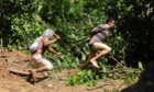 A Ka'apor Indian warrior (L) chases a logger who tried to escape after he was captured during a jungle expedition to search for and expel loggers from the Alto Turiacu Indian territory, near the Centro do Guilherme municipality in the northeast of Maranhao state in the Amazon basin, August 7, 2014.