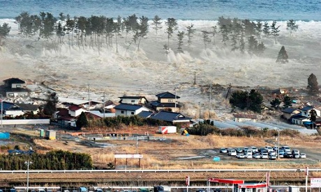 Tsunami waves hit homes in Natori